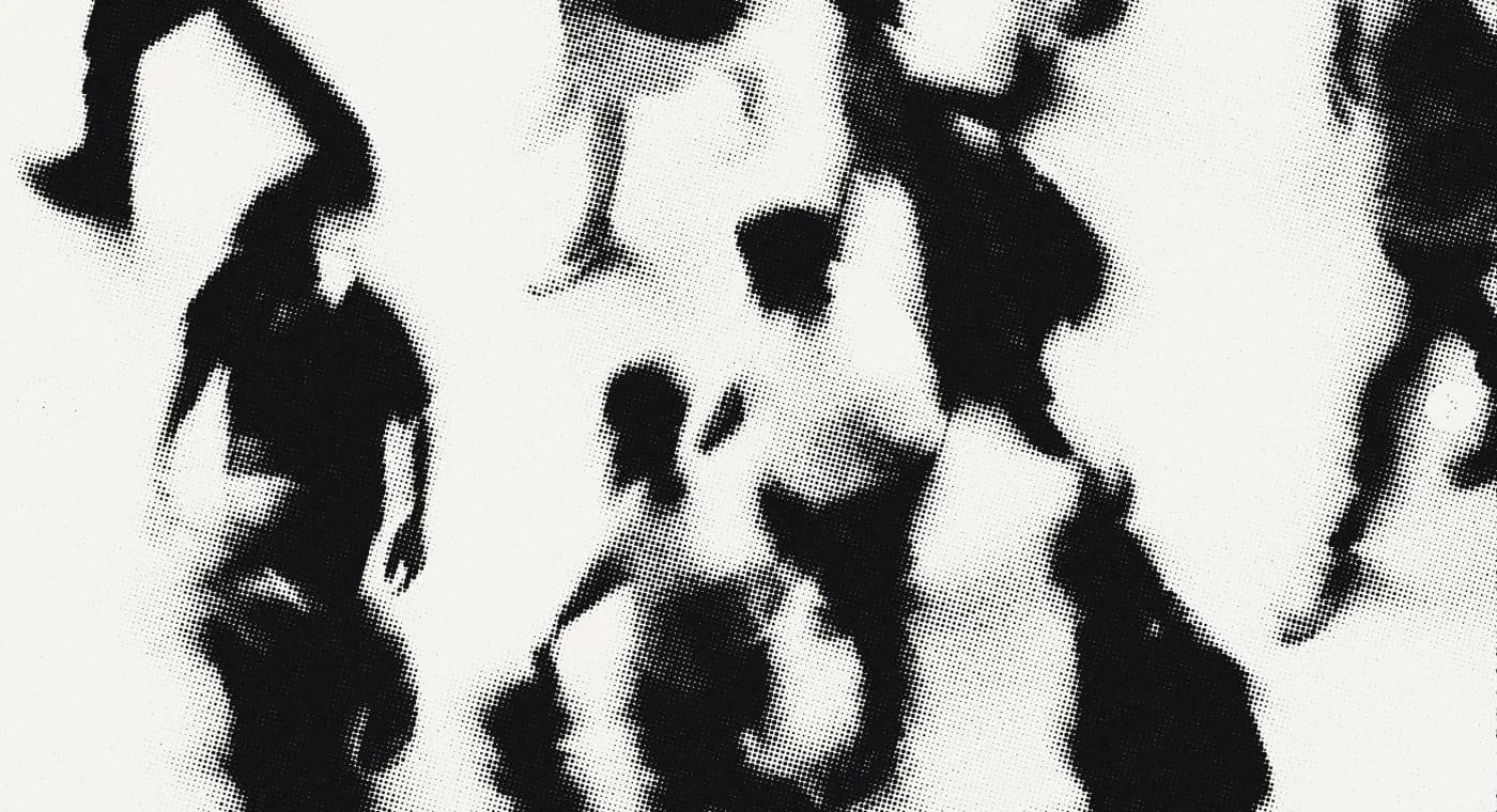 A crowd crossing, seen from above and blurred by motion